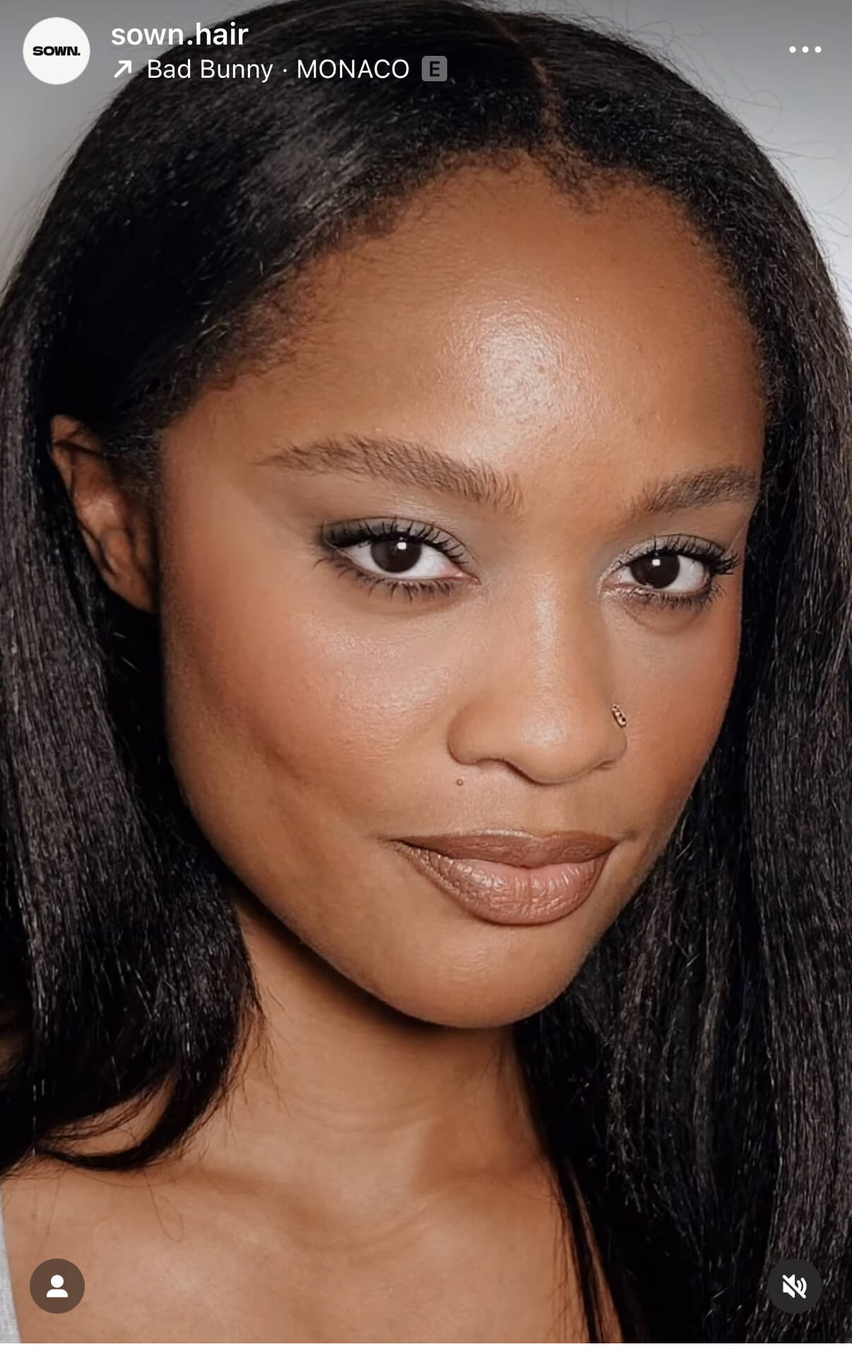 Close-up of sown model with styled 4c textured hair bundles , brand 'sown hair' visible